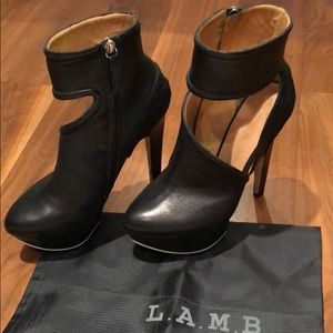 L.A.M.B platform ankle booties with cutouts.